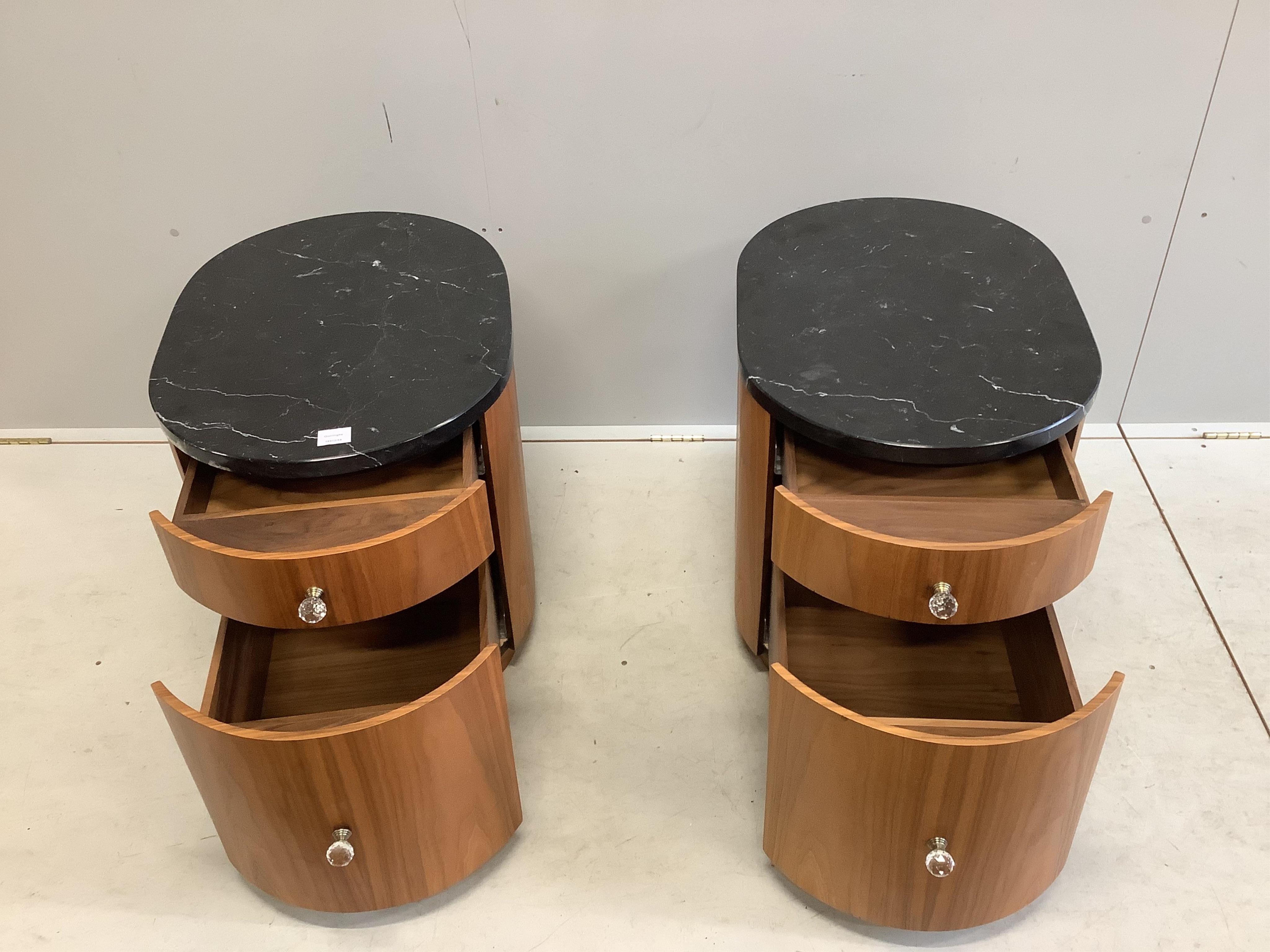 A pair of Contemporary black walnut and marble bedside cupboards, width 49cm, depth 67cm, height 56cm. Condition - fair to good